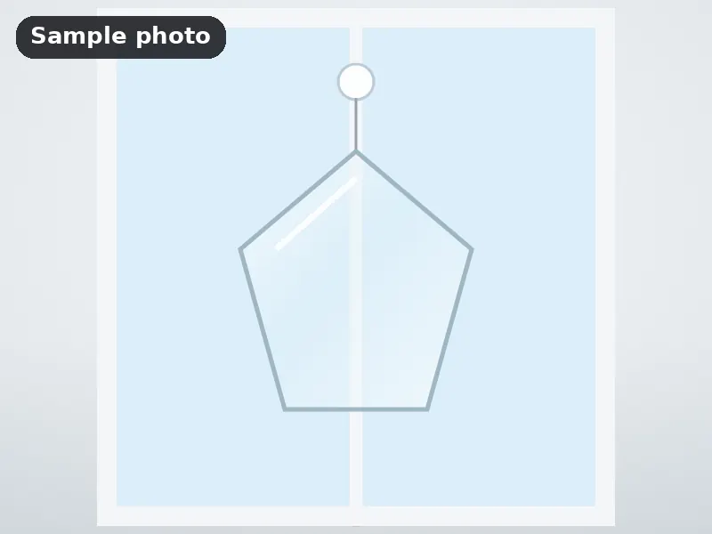 Sample photo: a blank clear acrylic suncatcher hanging in a window. Not Platinum Prints work.